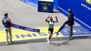 Hellen Obiri crossing the finish line of the 2024 Boston Marathon