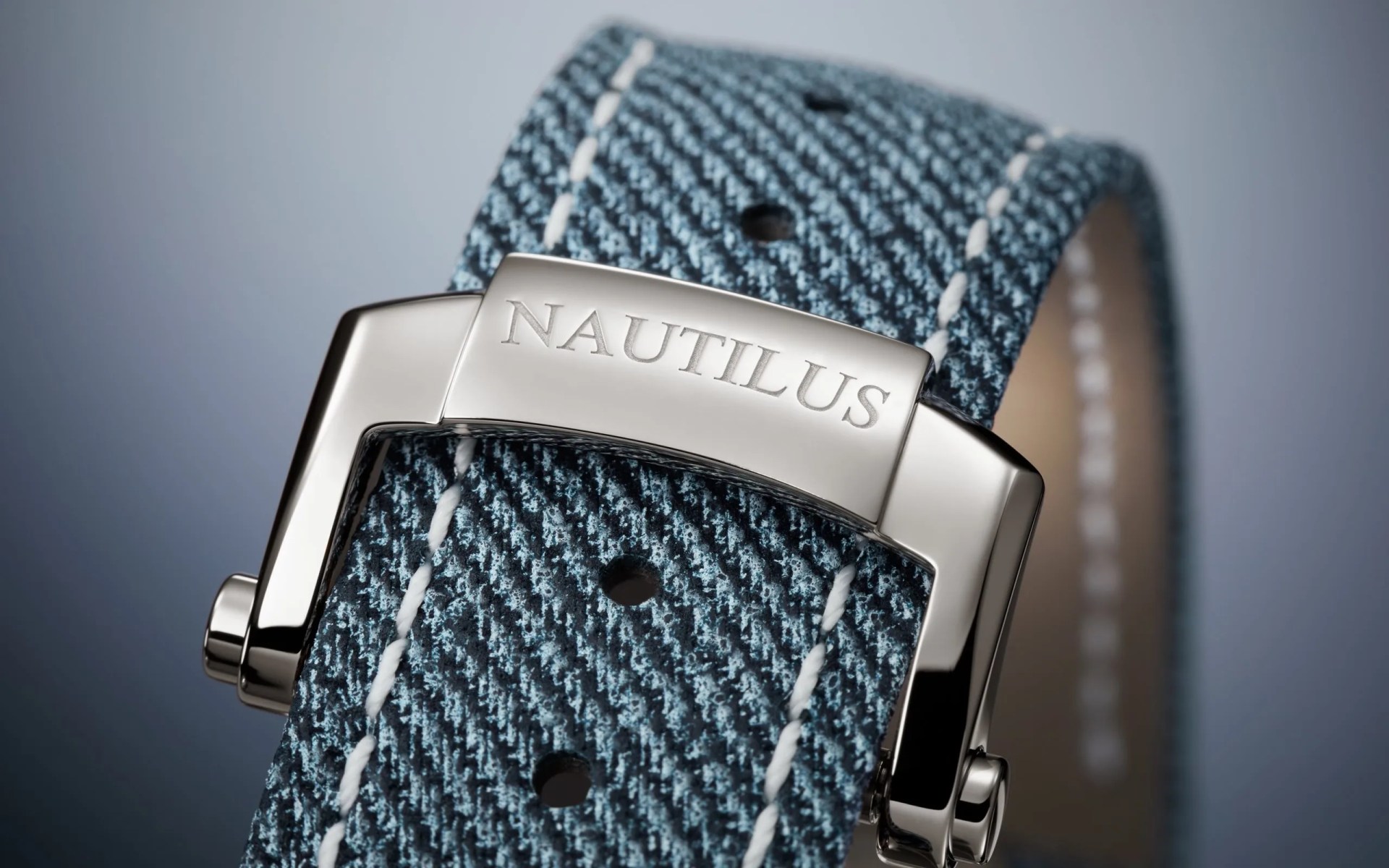 closeup of blue denim watch strap from patek philippe
