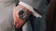steel rolex watch on man's wrist