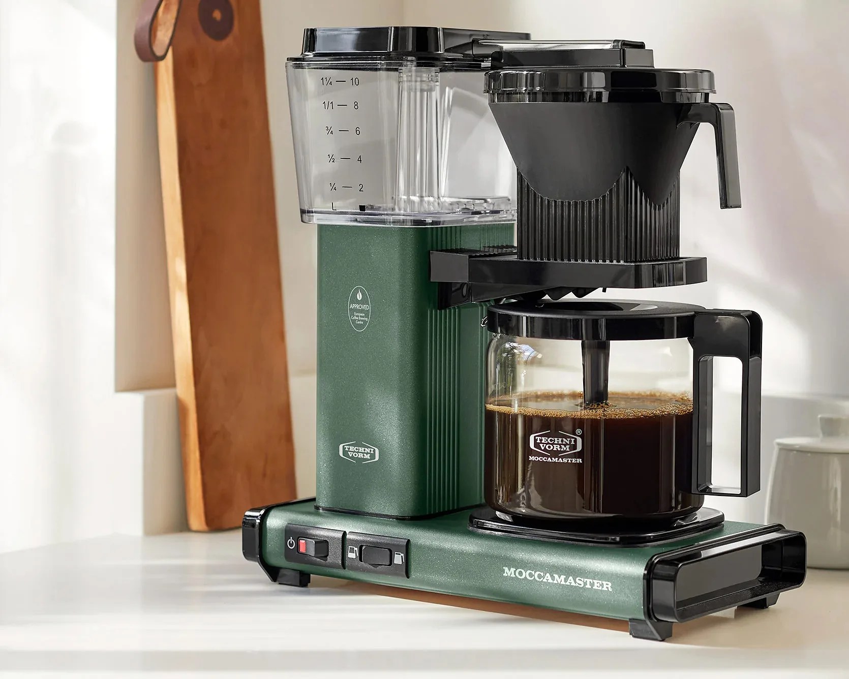 green coffee maker on kitchen counter