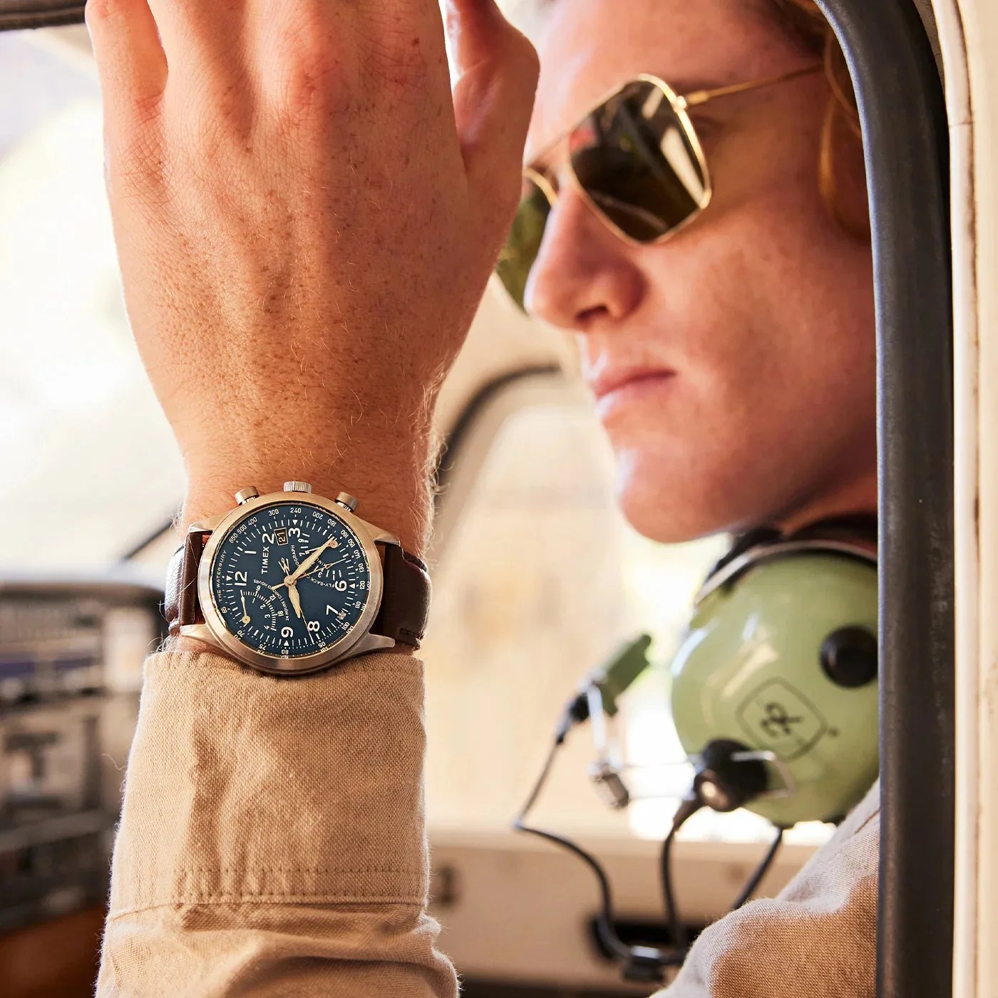 pilot wearing timex watch in cockpit