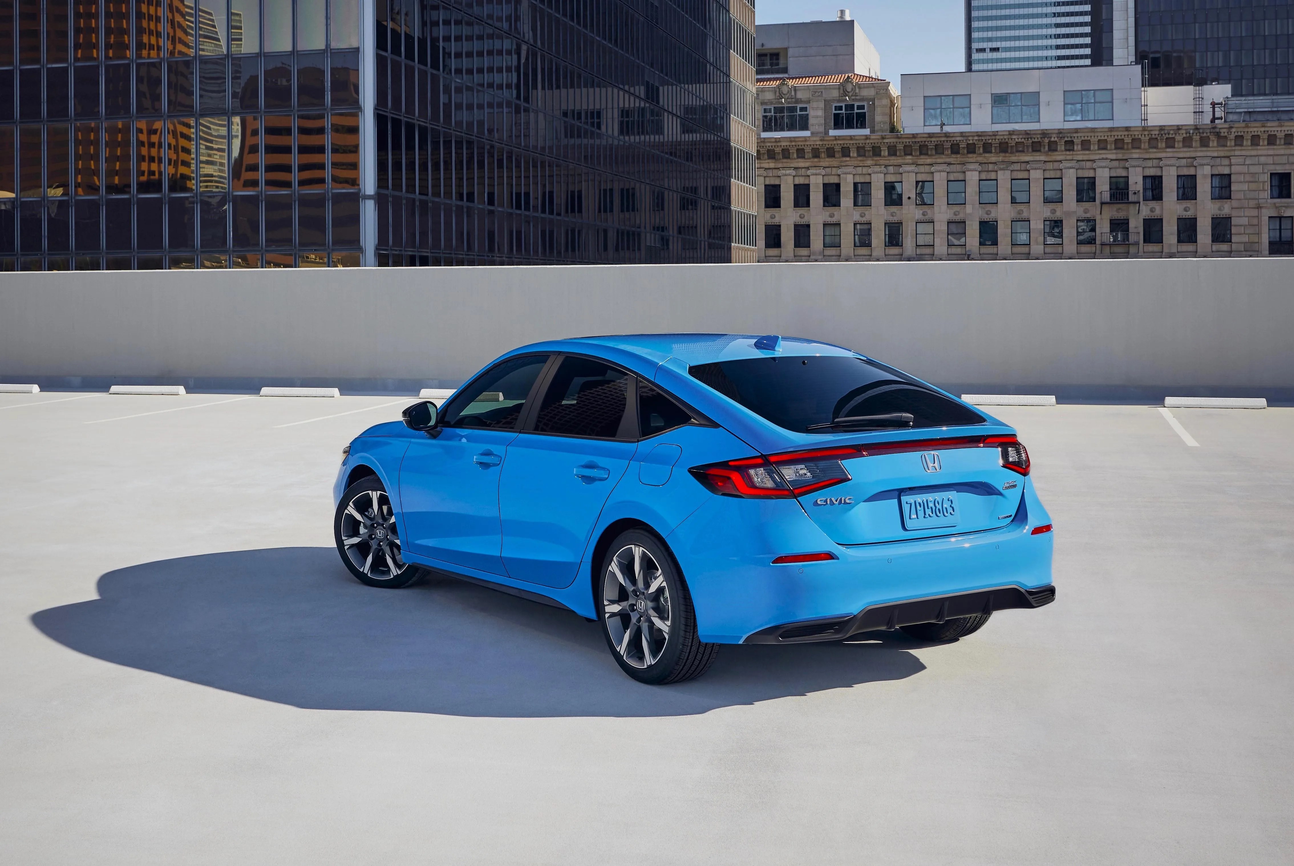 blue honda civic hatchback seen from the rear