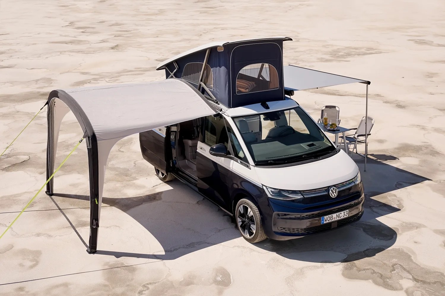 vw camper van with awnings on a beach