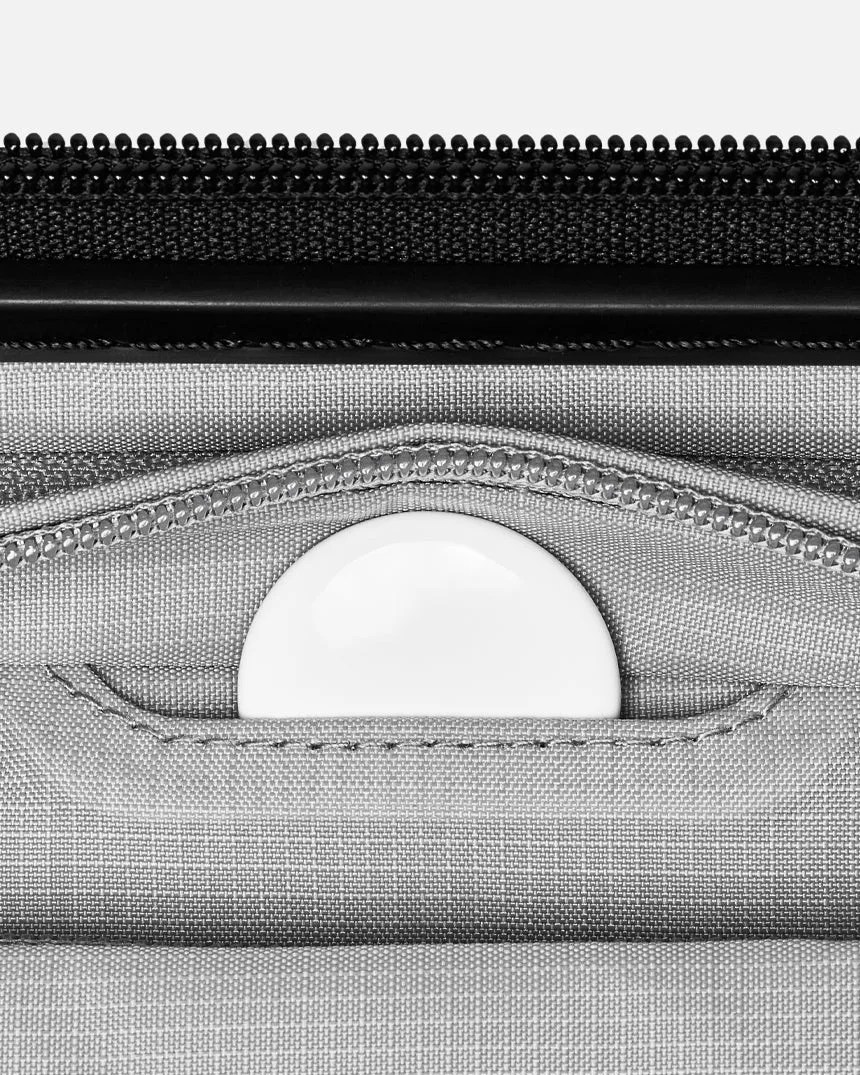 suitcase pocket for a smart tracker