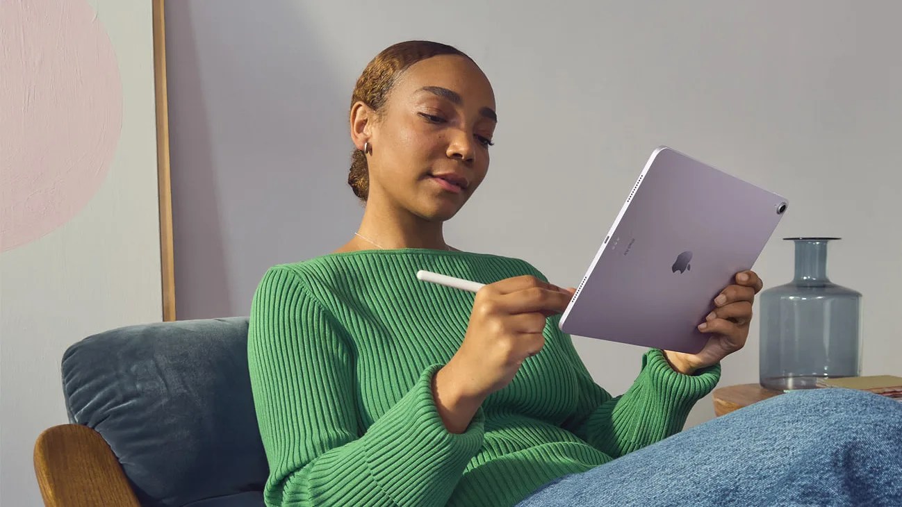 woman using a purple ipad air
