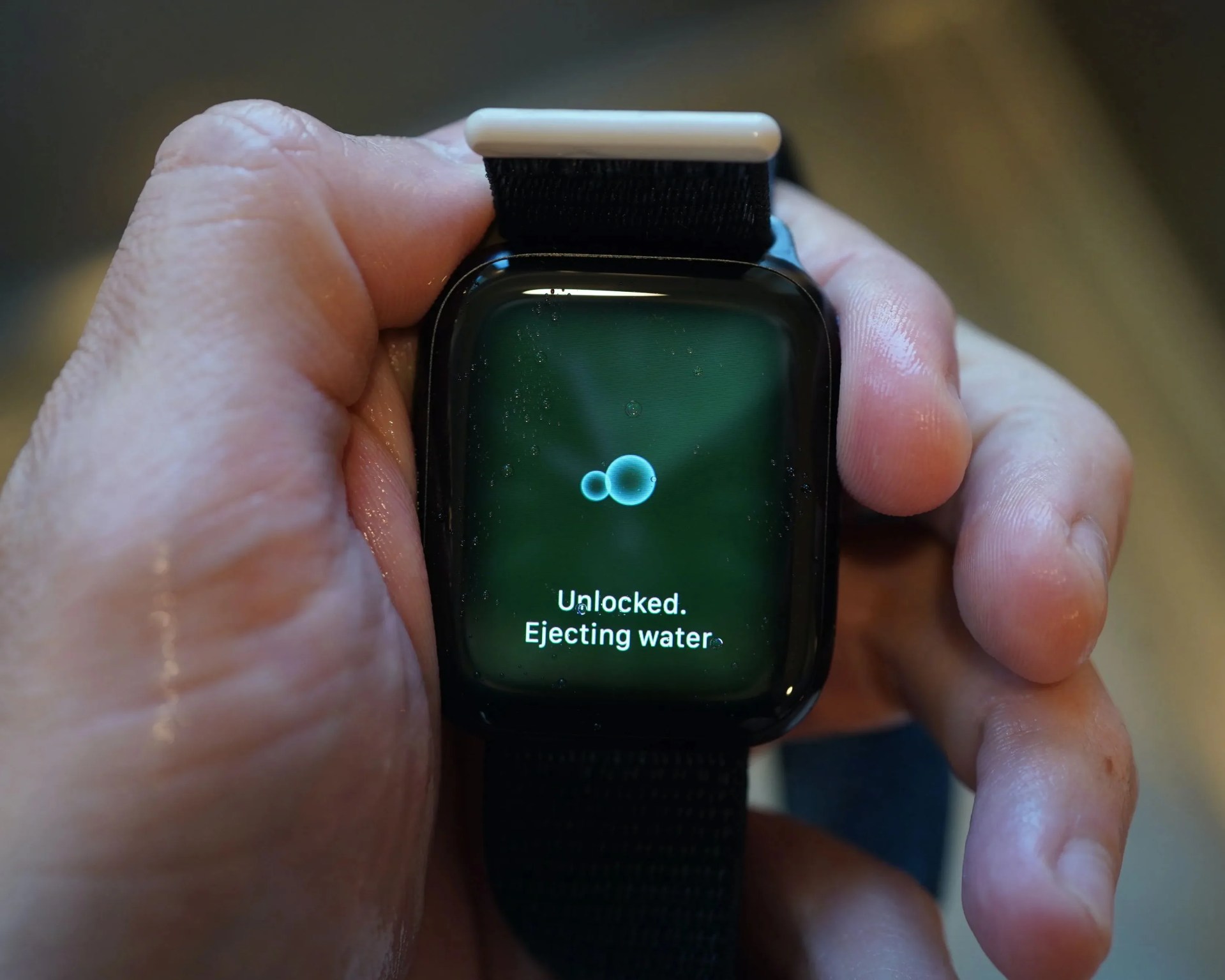 person holding an apple watch