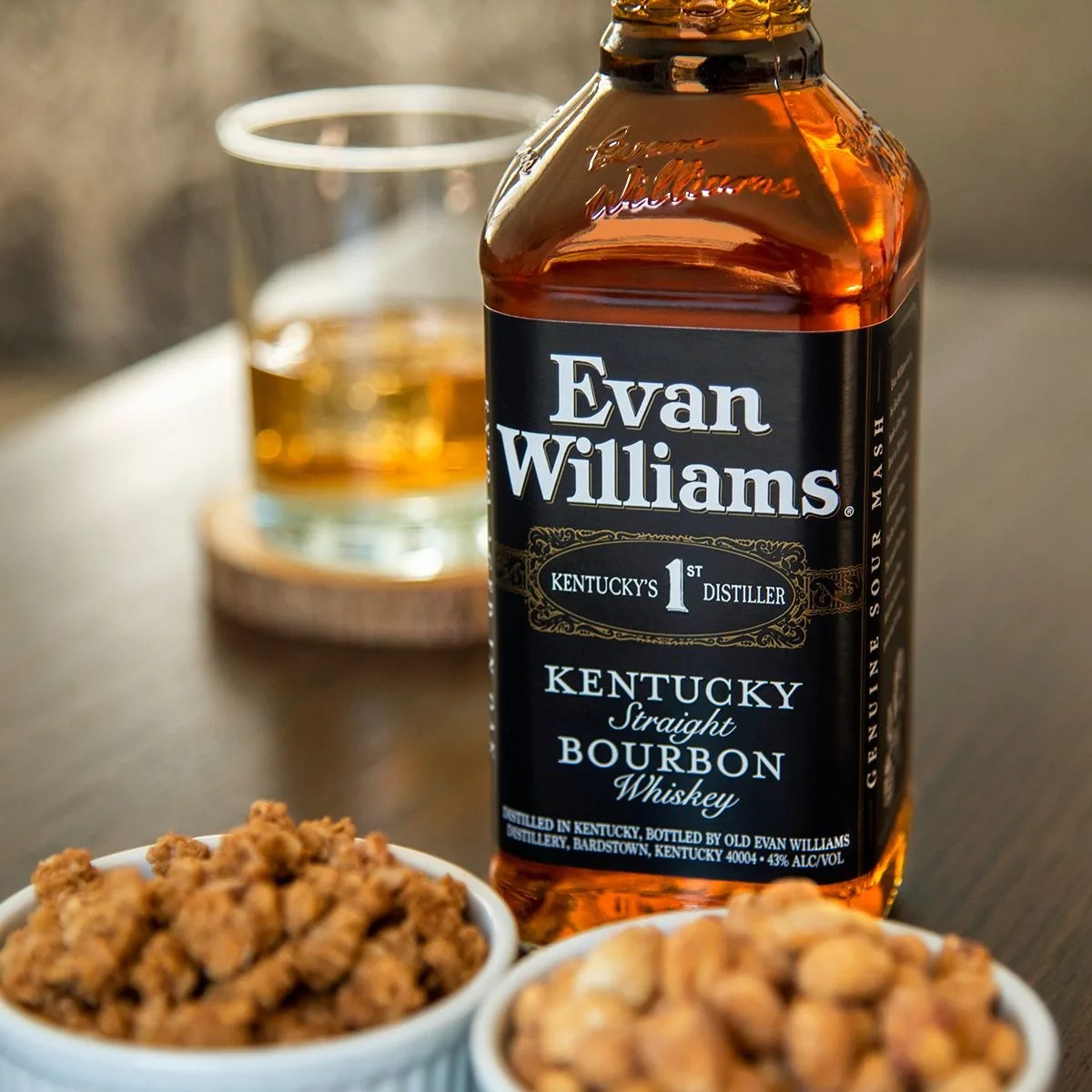 evan williams bourbon bottle next to some nuts