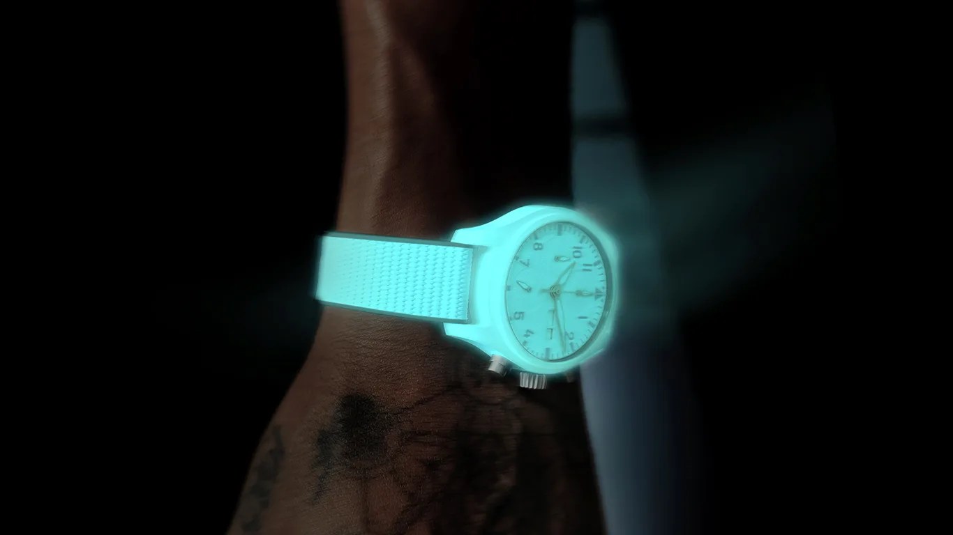 glowing iwc watch on a mans wrist