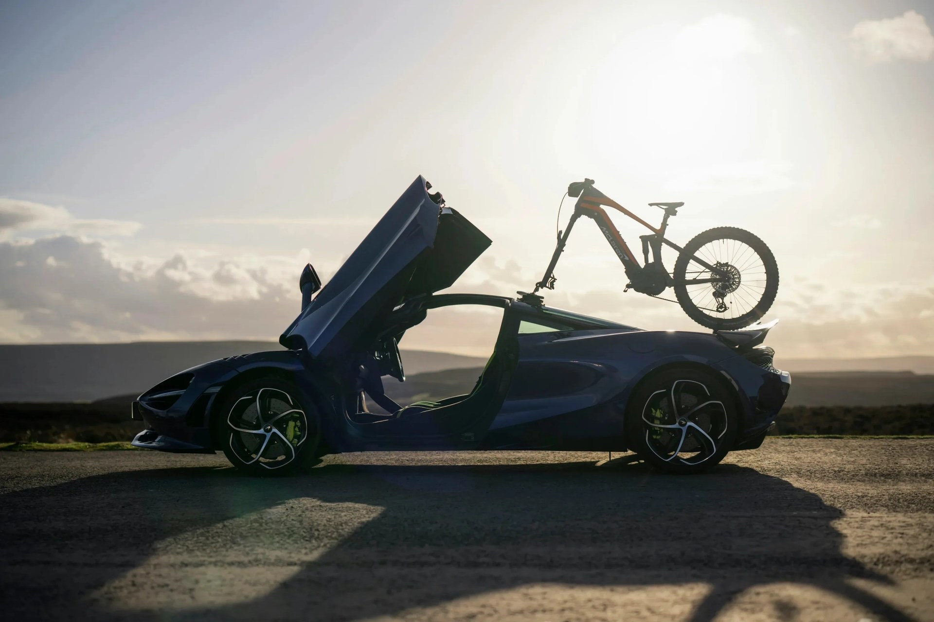 mclaren sports car with bike on top
