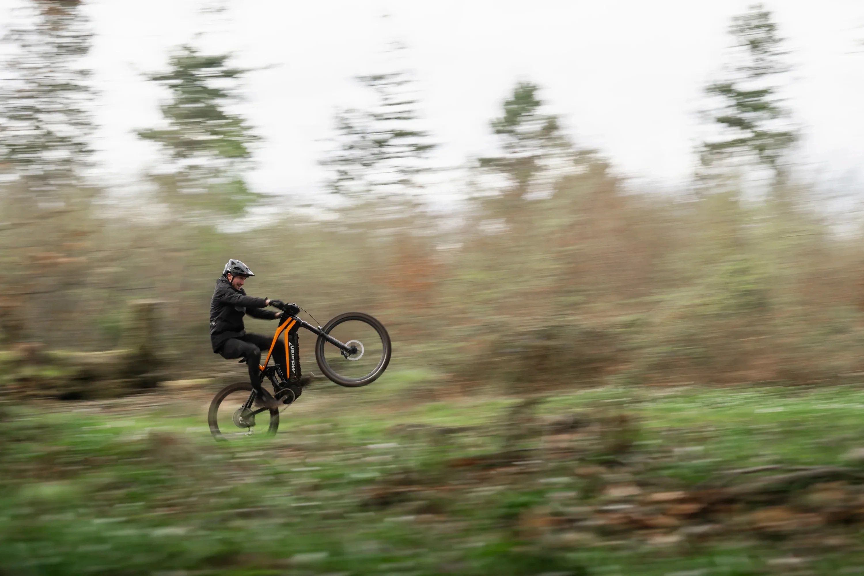 man rides mclaren mountain bike at a high speed