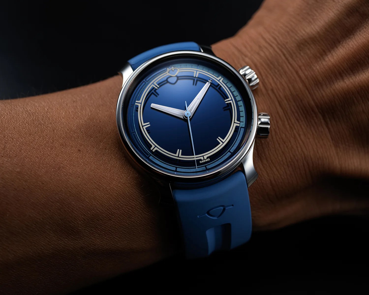 a ming dive watch on a mans wrist