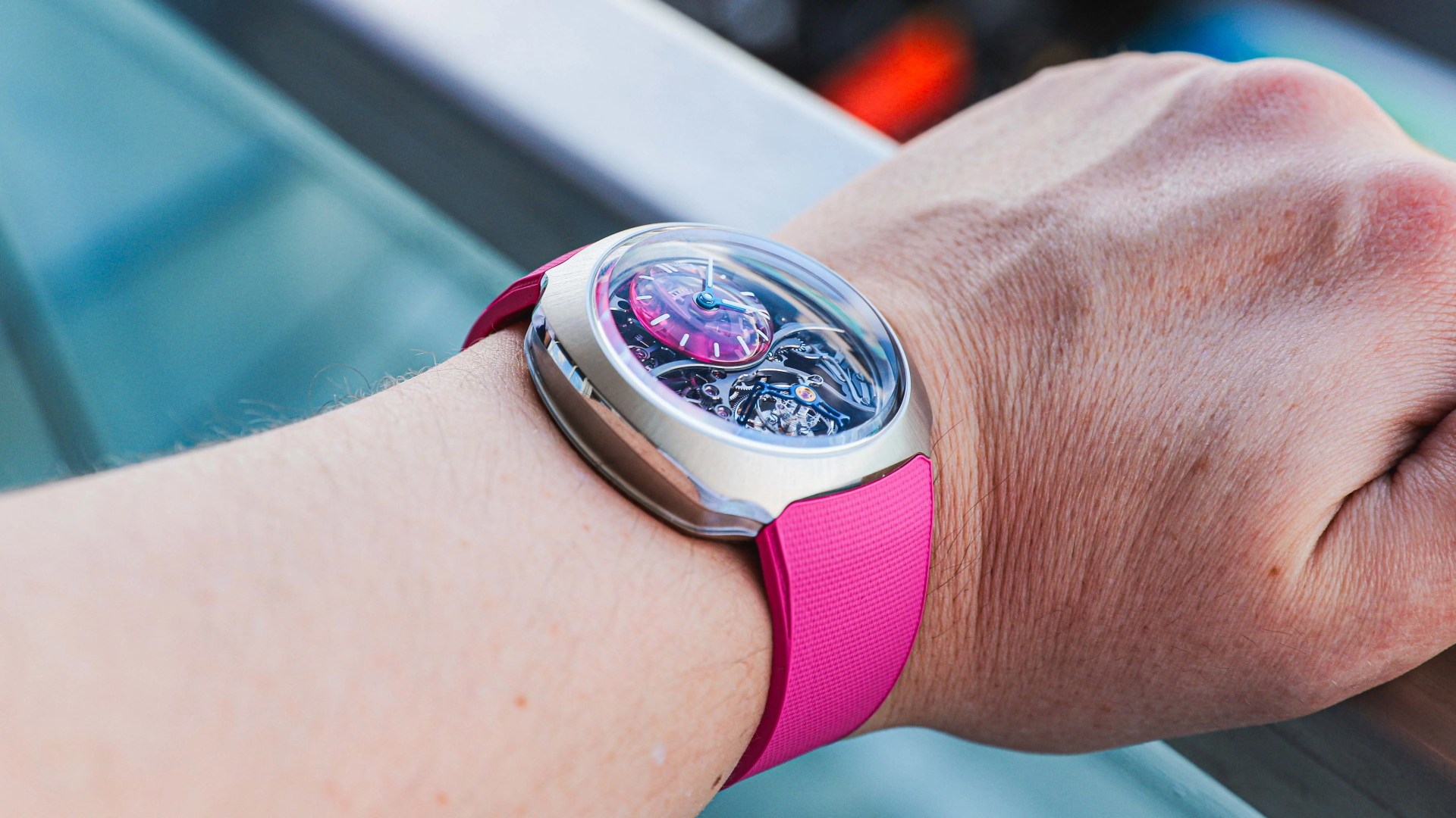 pink moser watch on mans wrist