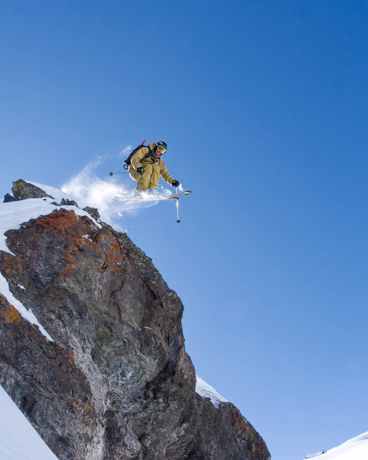 skiing off rock