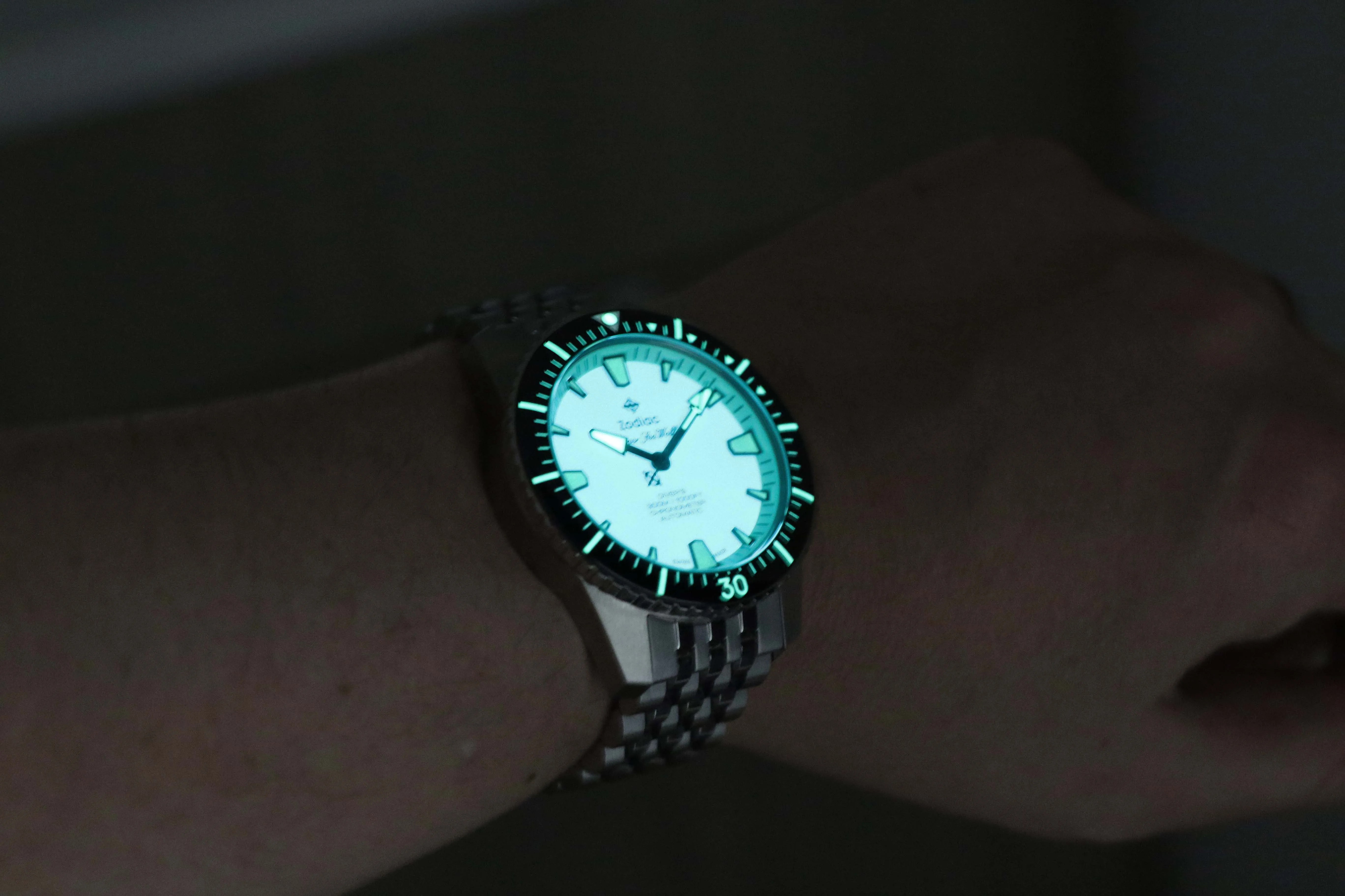 glowing zodiac watch on a mans wrist