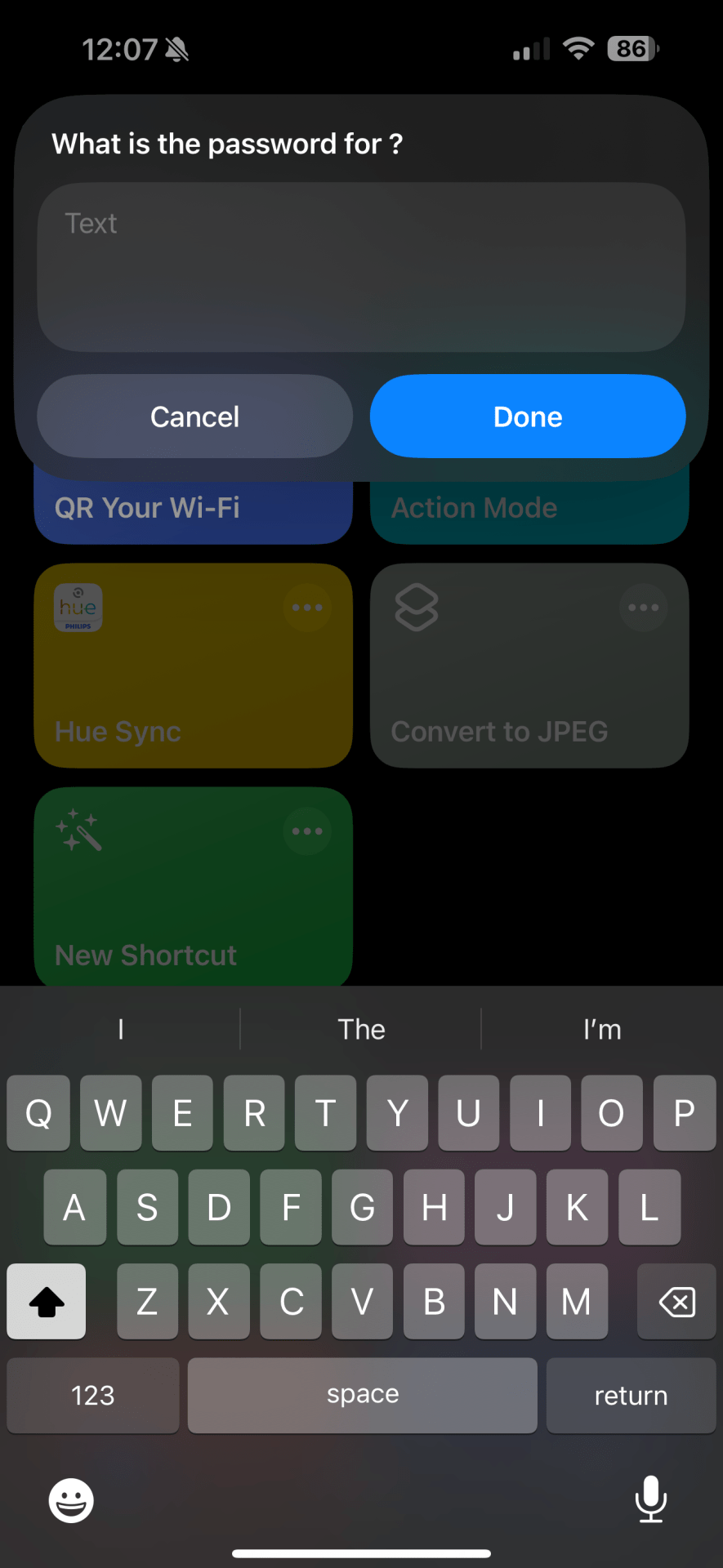 An iPhone screenshot of the iOS shortcuts app showing the pop-up that appears when users input their Wi-Fi network name and password to create a Wi-Fi QR code.