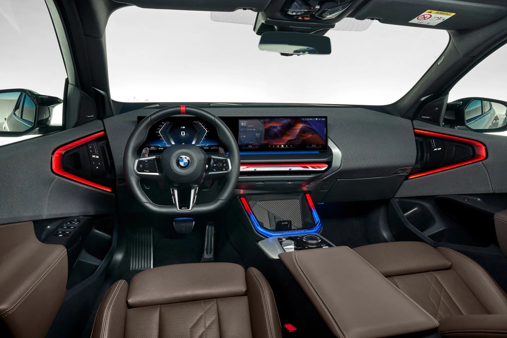 An image of the front dashboard and seats insidethe 2025 BMW X3