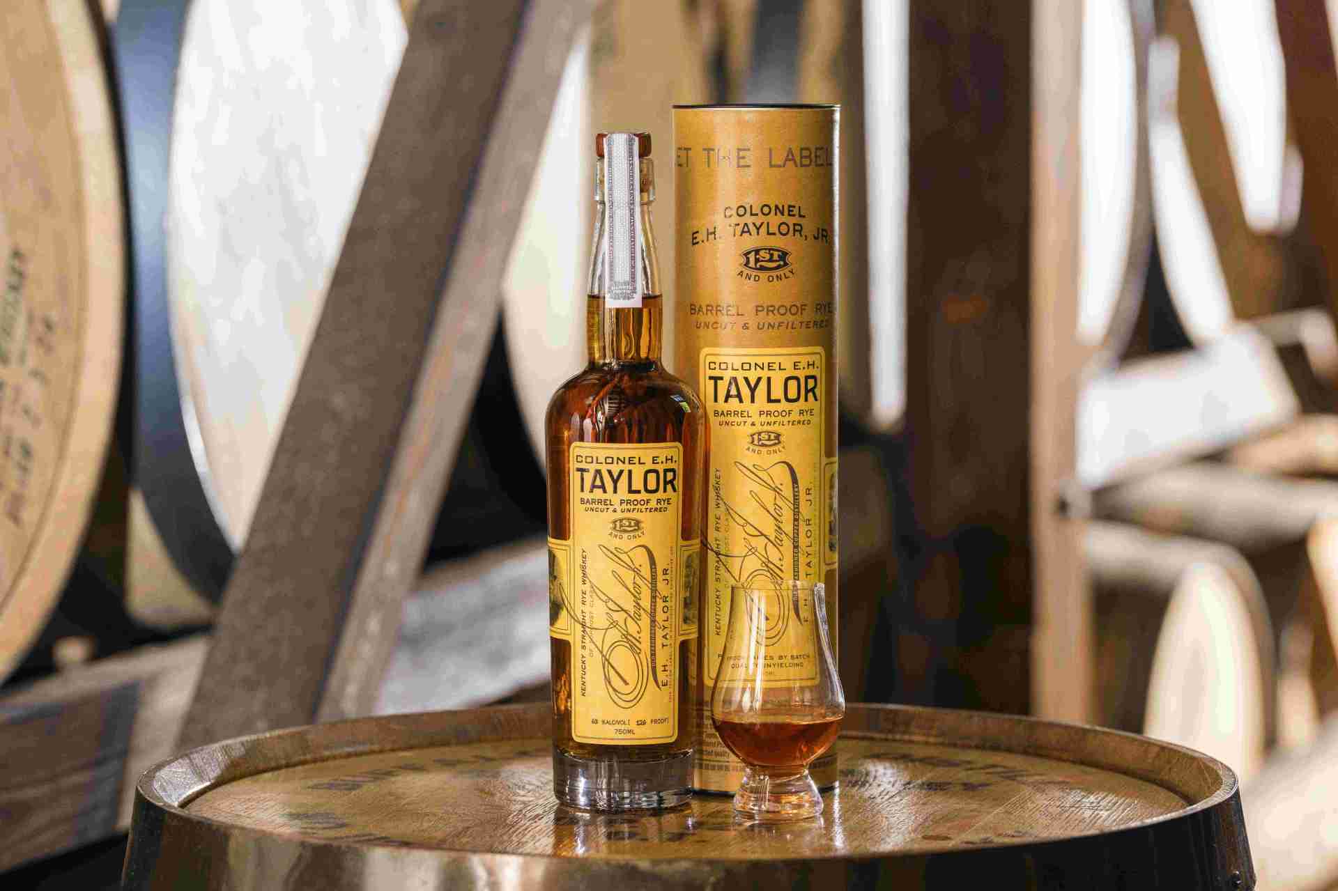 bottle of eh taylor whiskey in a rickhouse