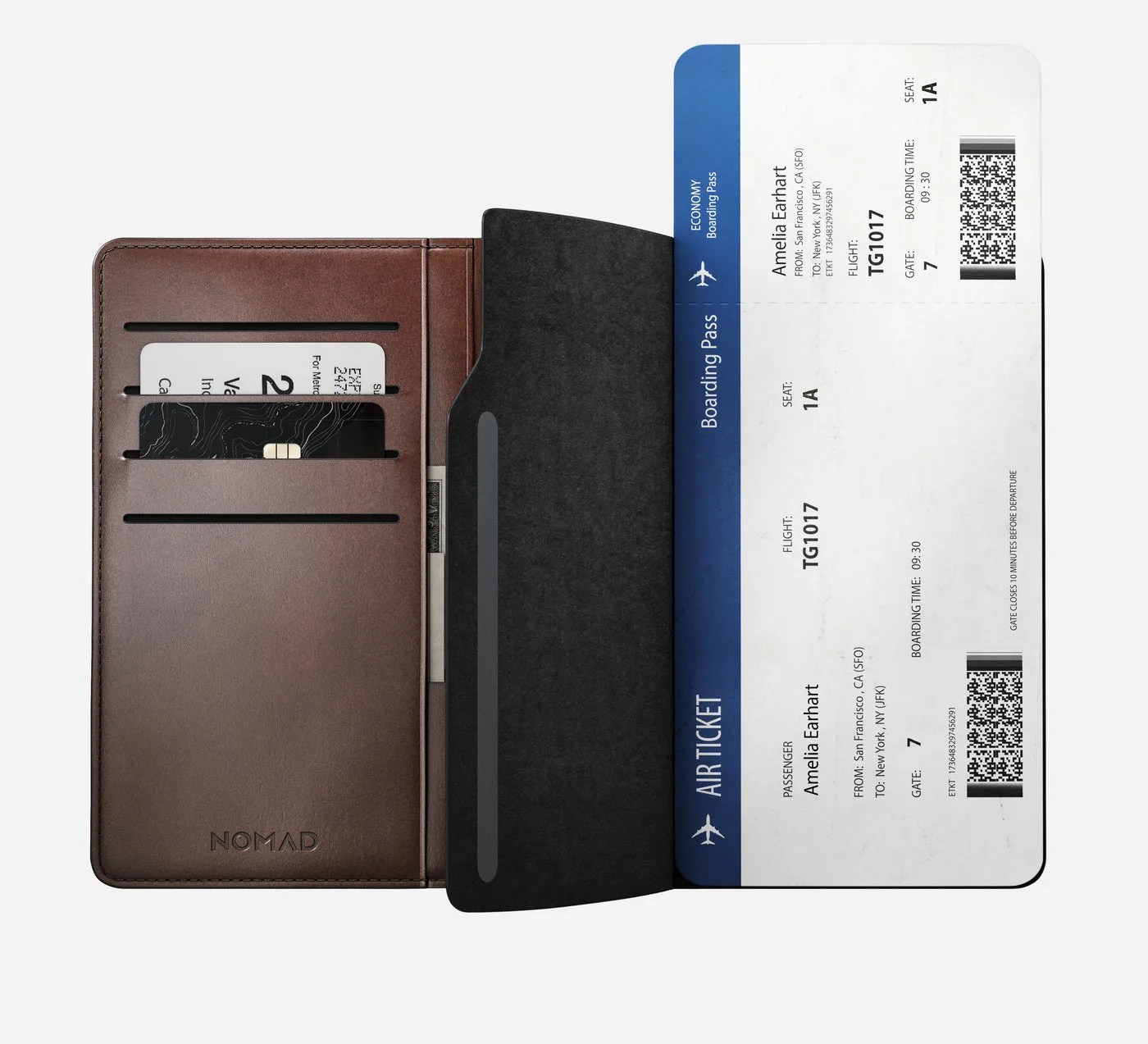 Nomad Passport Wallet opened to show the magnetic flap enclosure which can secure hold larger travel documents like airline tickets