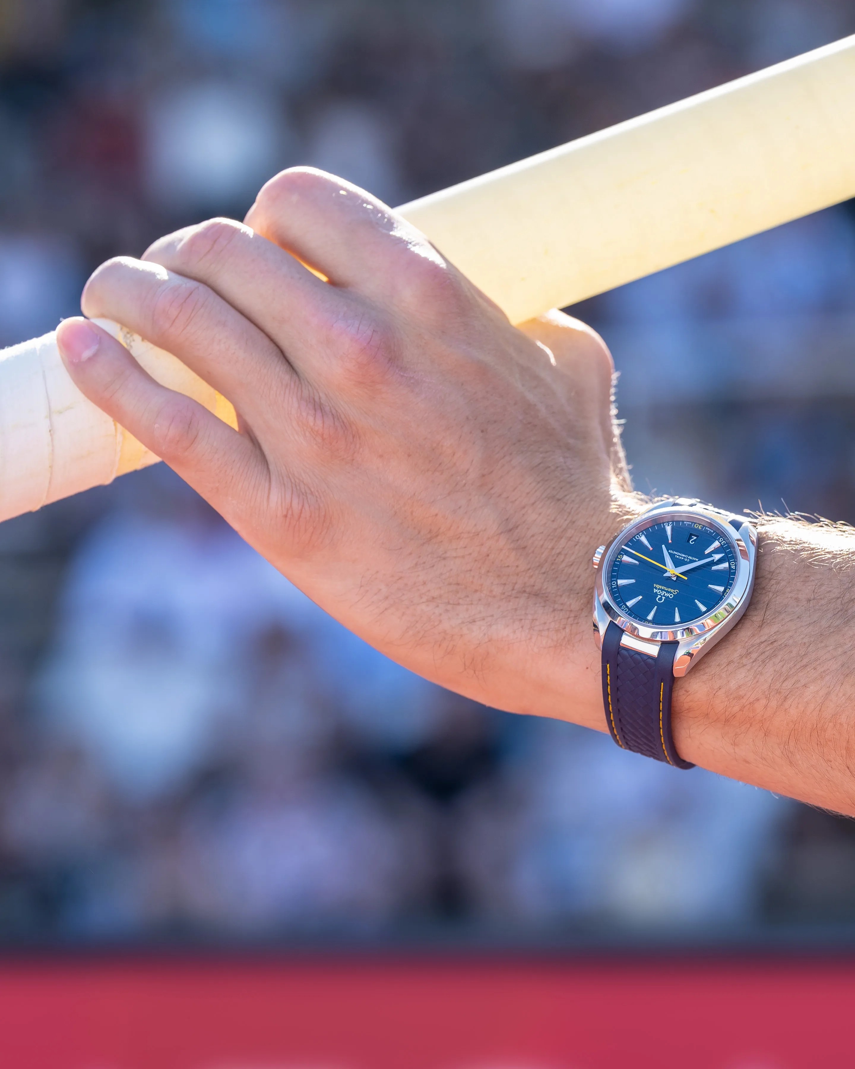 omega watch on the wrist of a pole vaulter