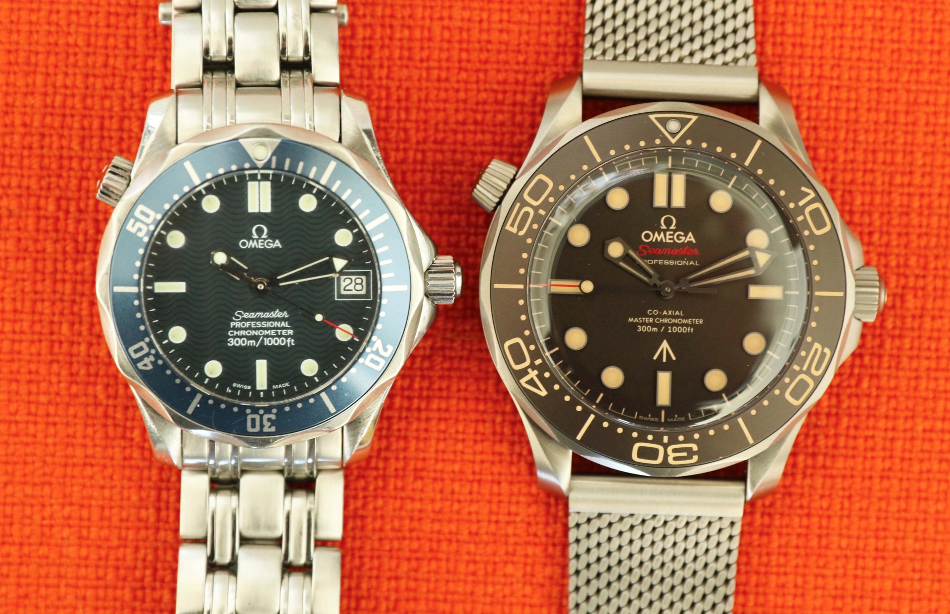 two omega seamaster dive watches next to each other