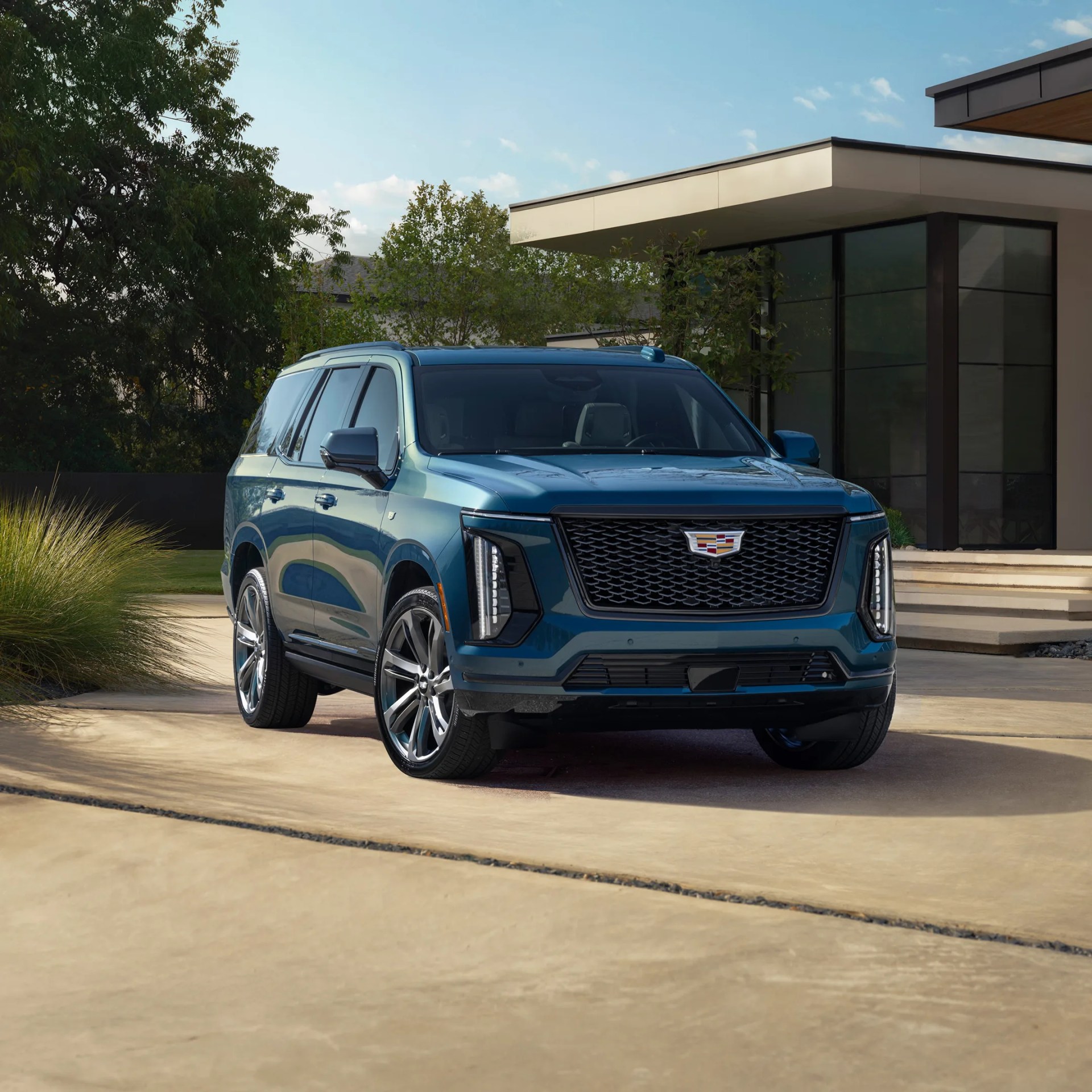 Cadillac escalade in front of a house