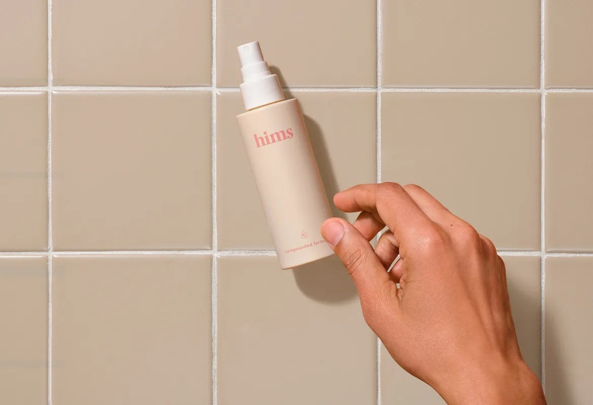 Bottle of Hims hair care on countertop
