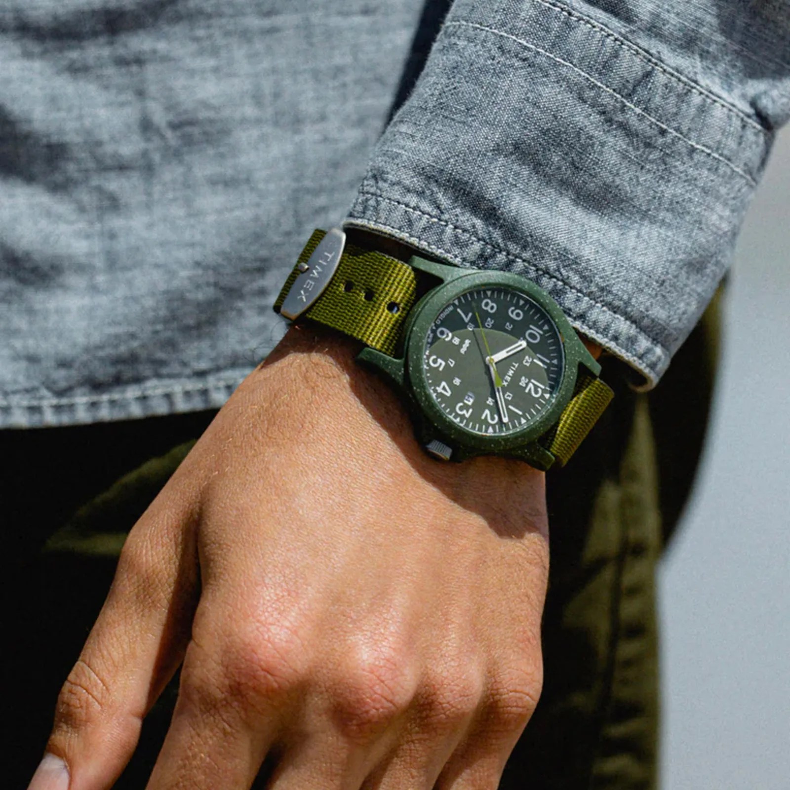 A Timex Reclaim Ocean watch on male wrist