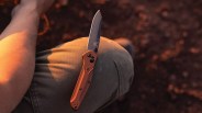 benchmade pocket knife on a mans knee