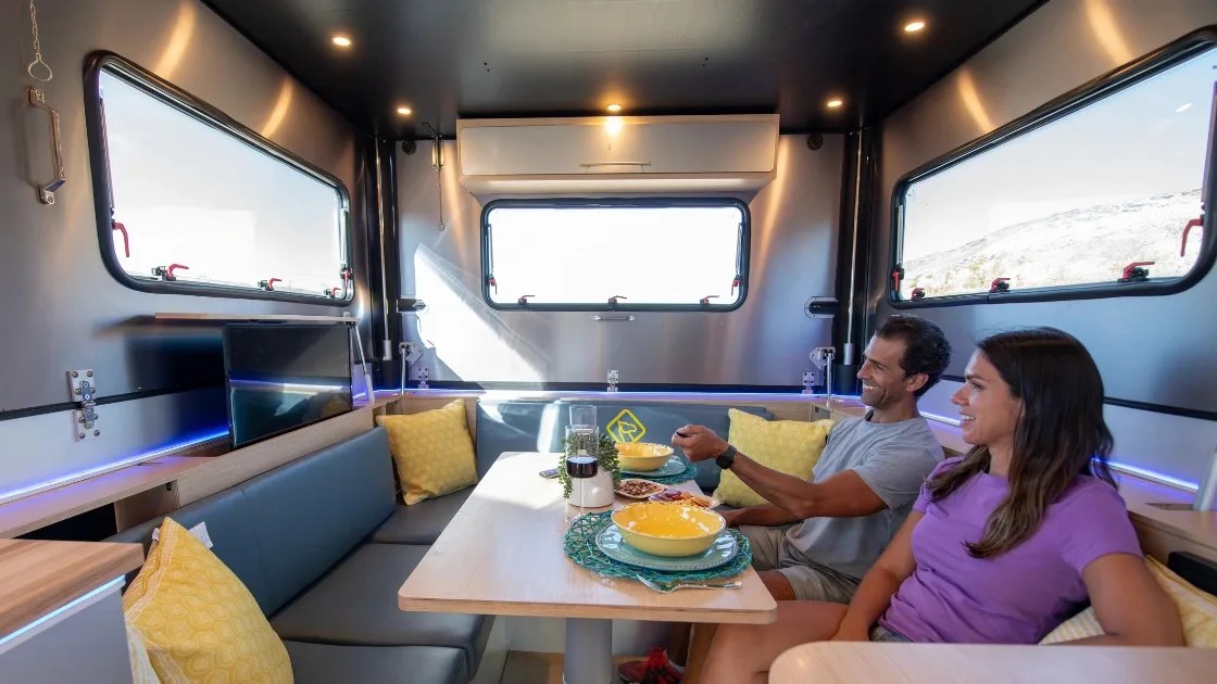 people watch television inside an exodus camper
