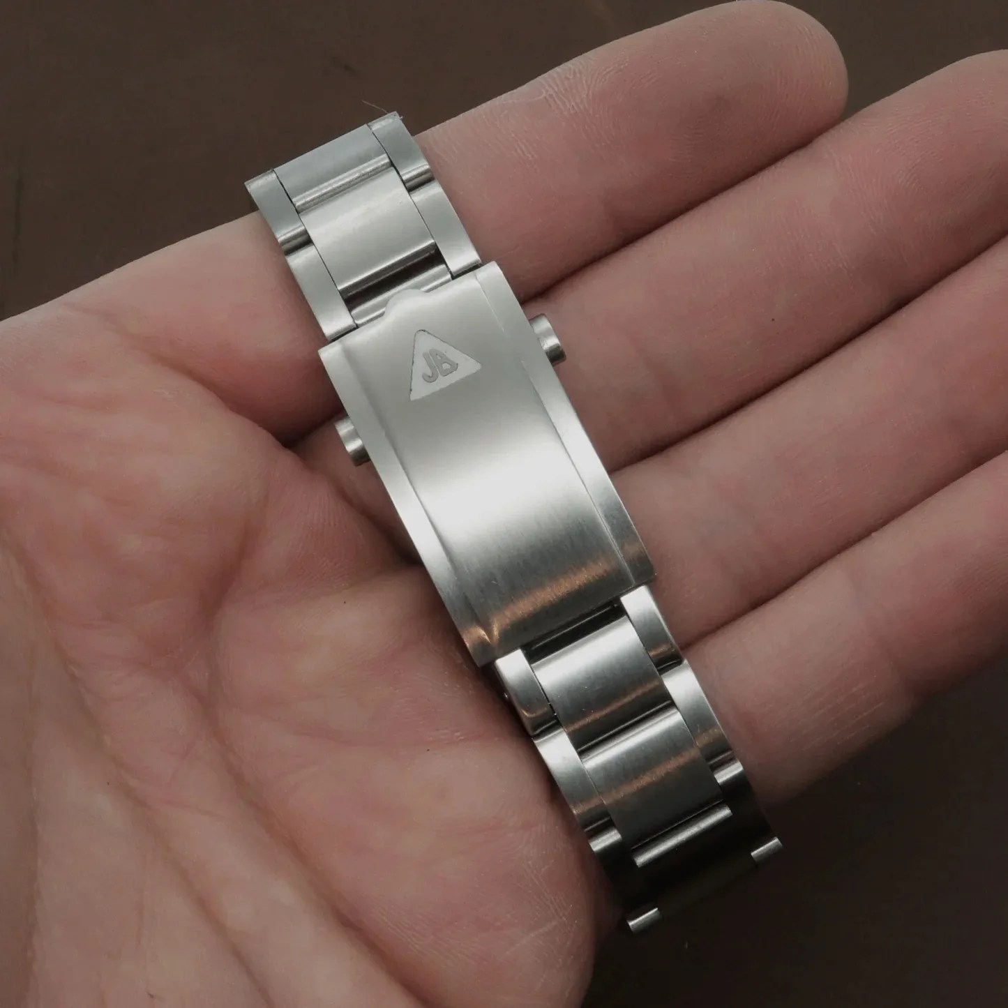 forstner watch bracelet in a persons hand