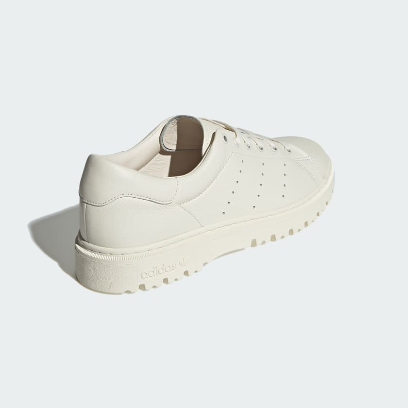 Adidas-Stan-Smith-Friezeit in white on grey background.