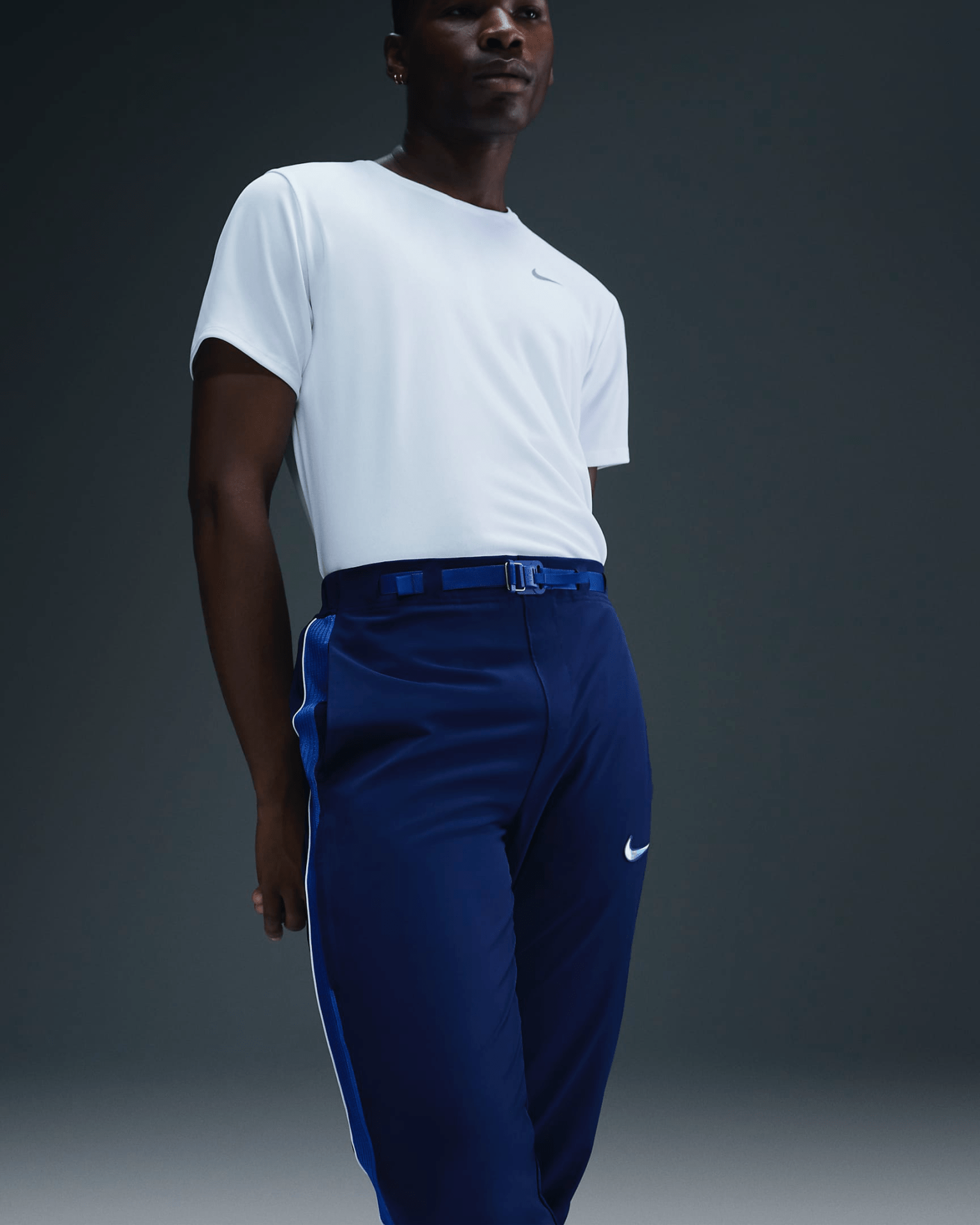 Shot of the waistline of Nike’s dark blue Team USA medal podium pant highlighting the matching blue integrated belt.