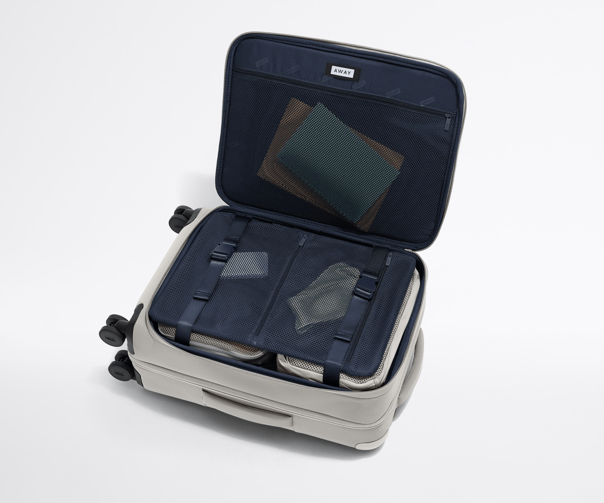 Away Softside bag shown open to reveal the compression panel and interior organization pockets