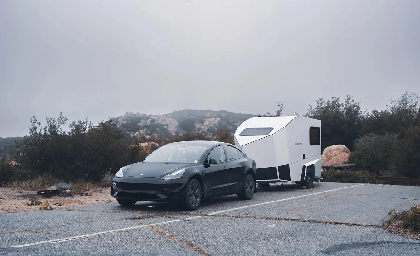 polydrops p21 parked behind a tesla