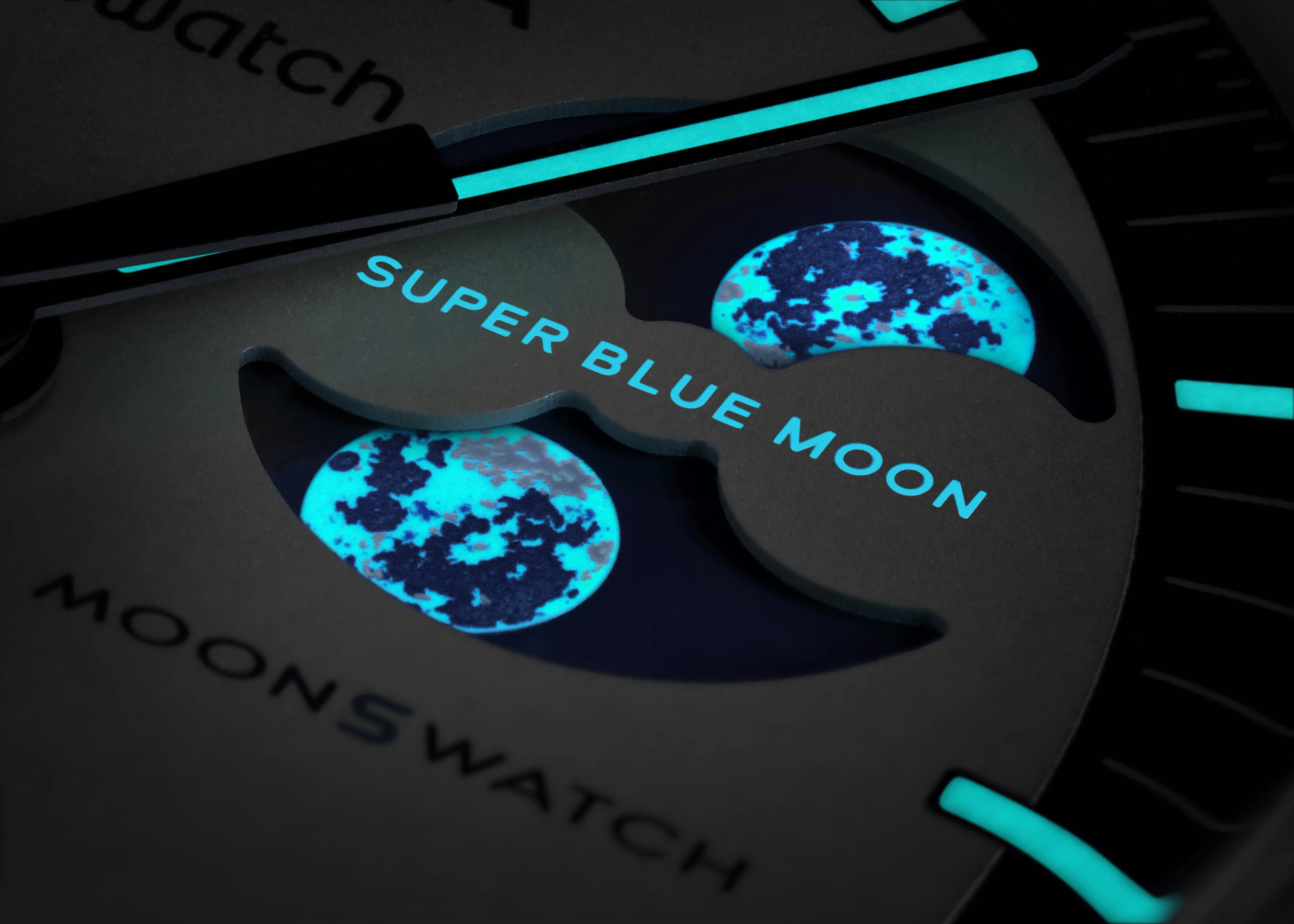 swatch x omega moonswatch watch luminous moonphase closeup
