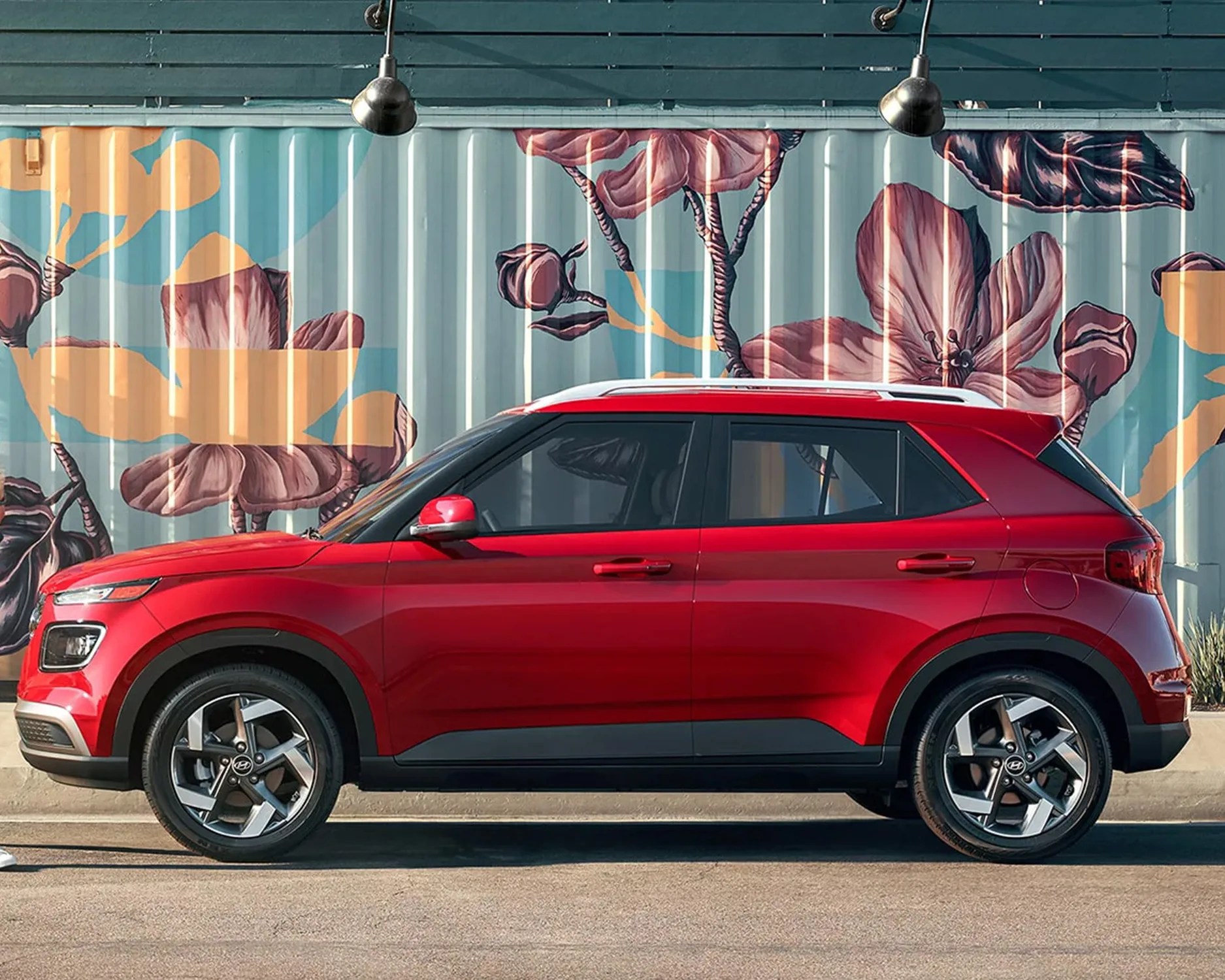 red hyundai suv parked