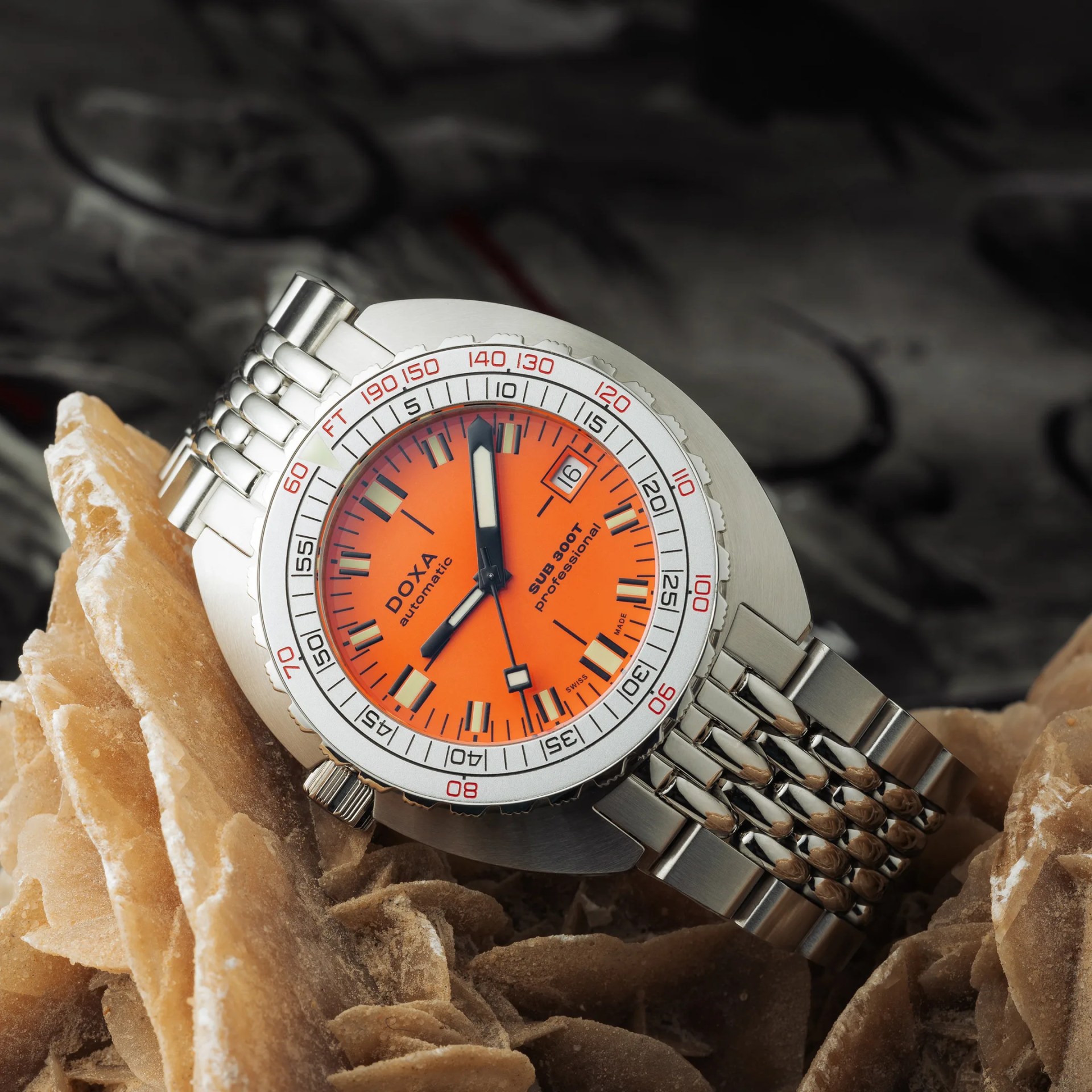 a doxa dive watch with an orange dial