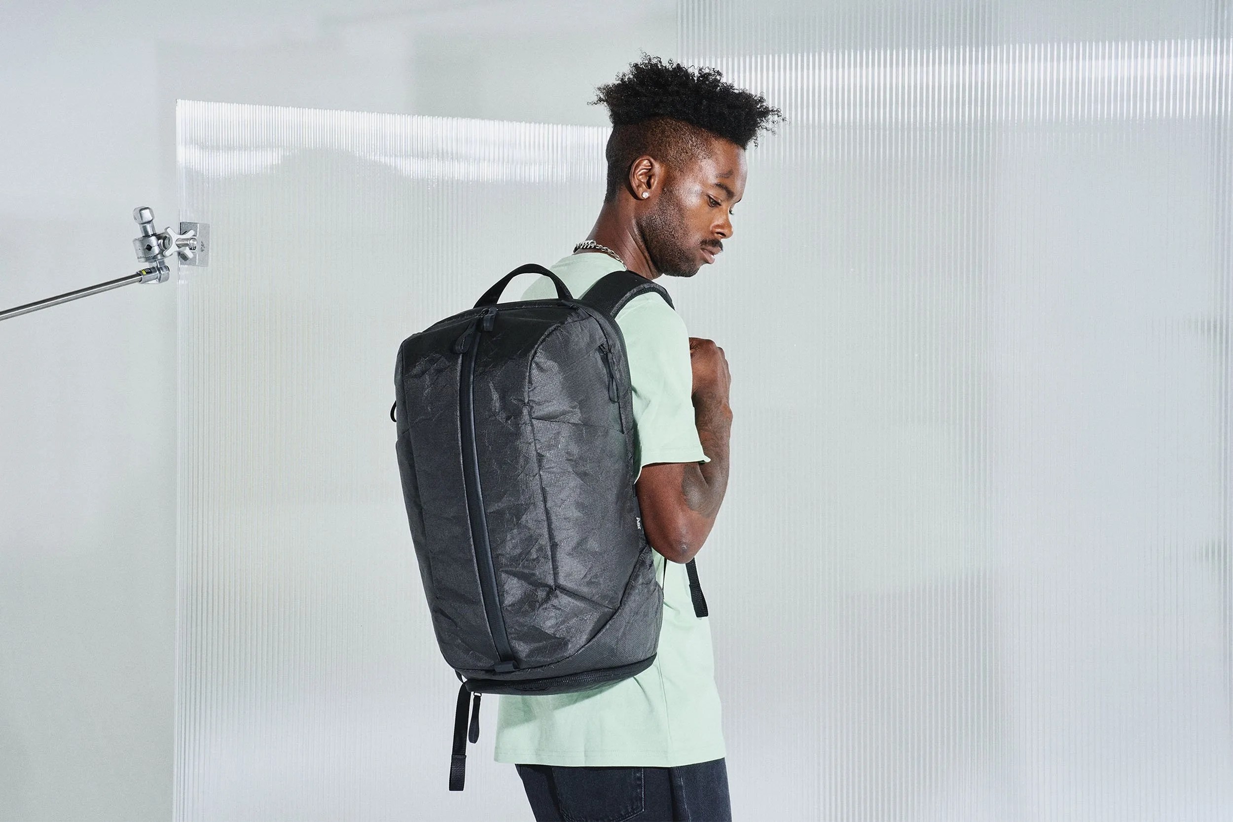 a man wears an aer backpack