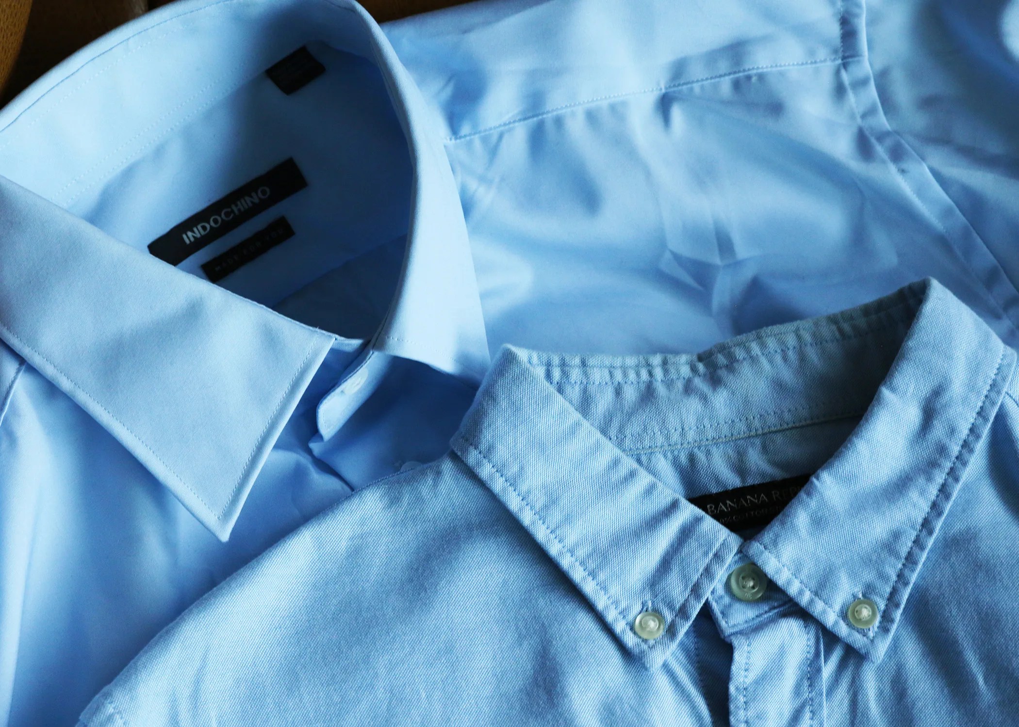 two blue mens shirts