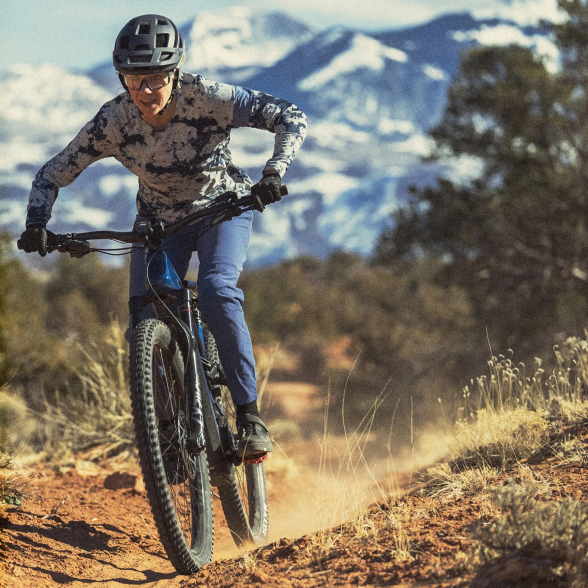 woman riding cannondale electric mountain bike