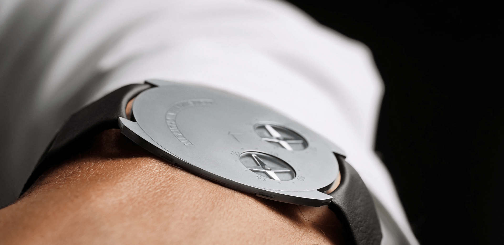The Konstantin Chaykin ThinKing watch worn on a wrist showed from the side to highlight the timepiece’s recording breaking thinness. 
