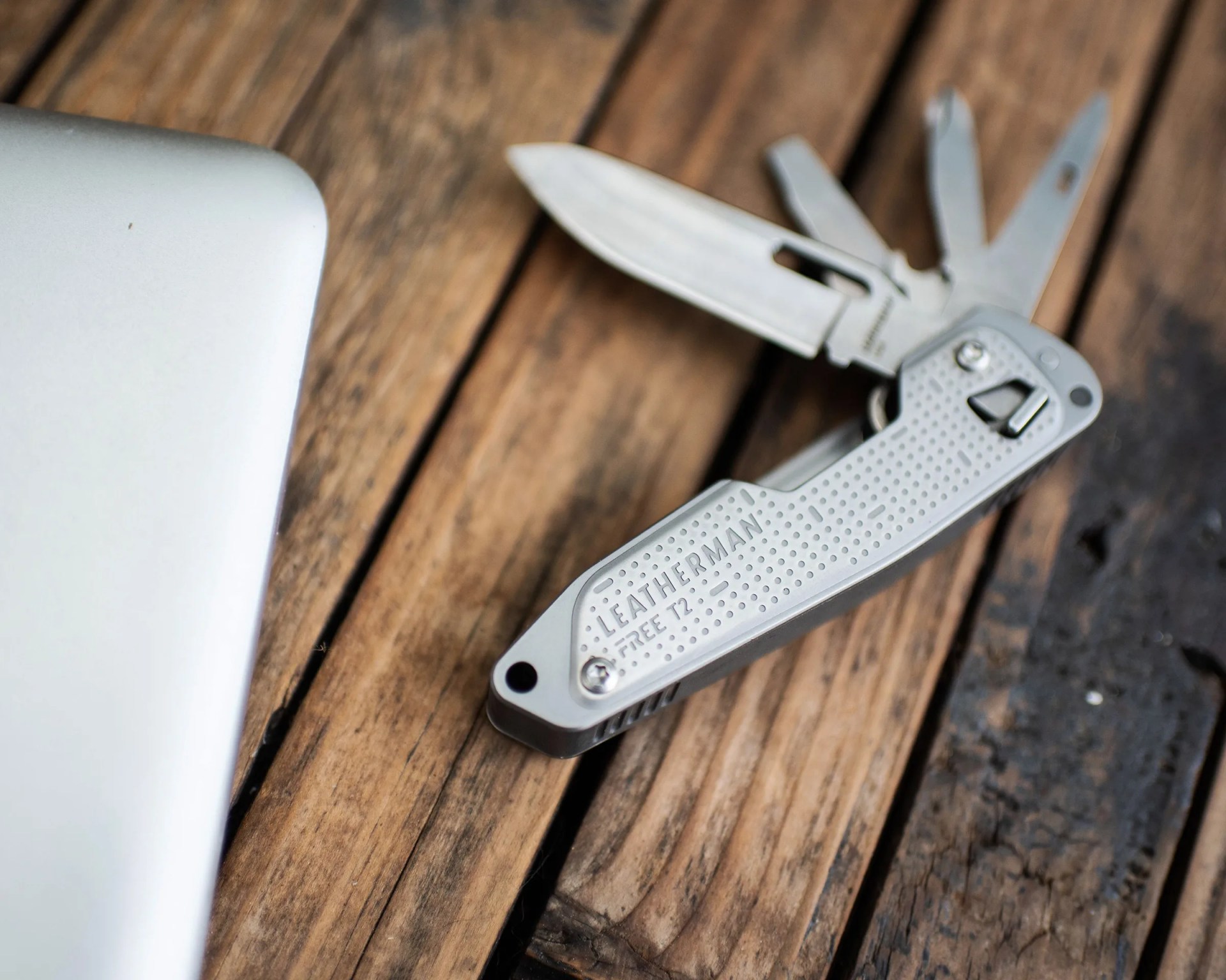multi tool knife on wood table