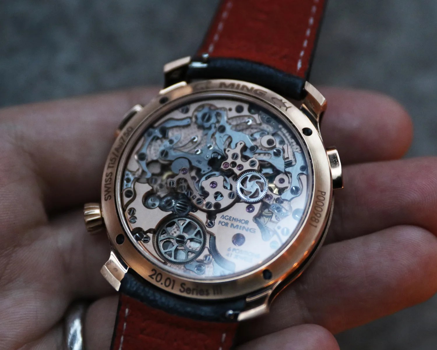 ming watch movement seen through a sapphire caseback