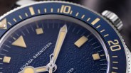 closeup of a blue nivada grenchen dive watch dial