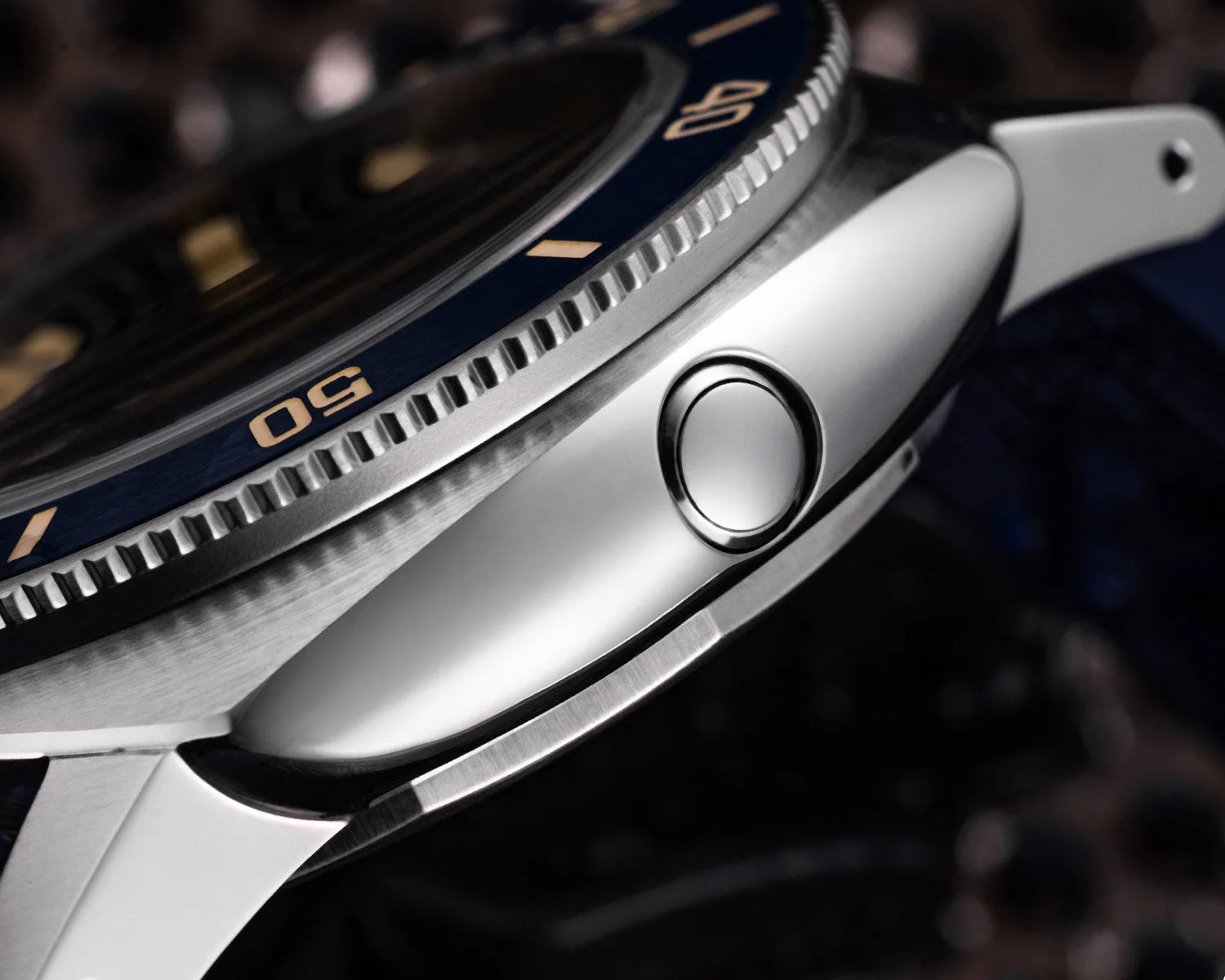 the side of a nivada dive watch showing a helium escape valve
