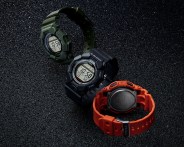three casio g-shock watches on black material