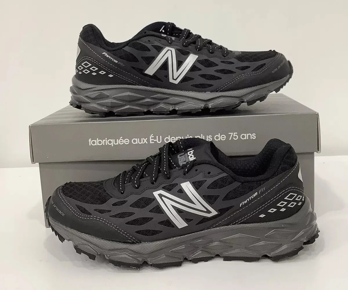 Ebay product listing for New Balance 950v2 sneakers showing a pair sitting on and next two a New Balance sneaker box on a grey backgroun