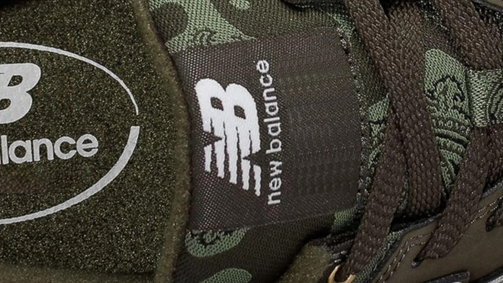 Image of the tongue of a camo sneaker showing the New Balance logo