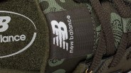 Image of the tongue of a camo sneaker showing the New Balance logo