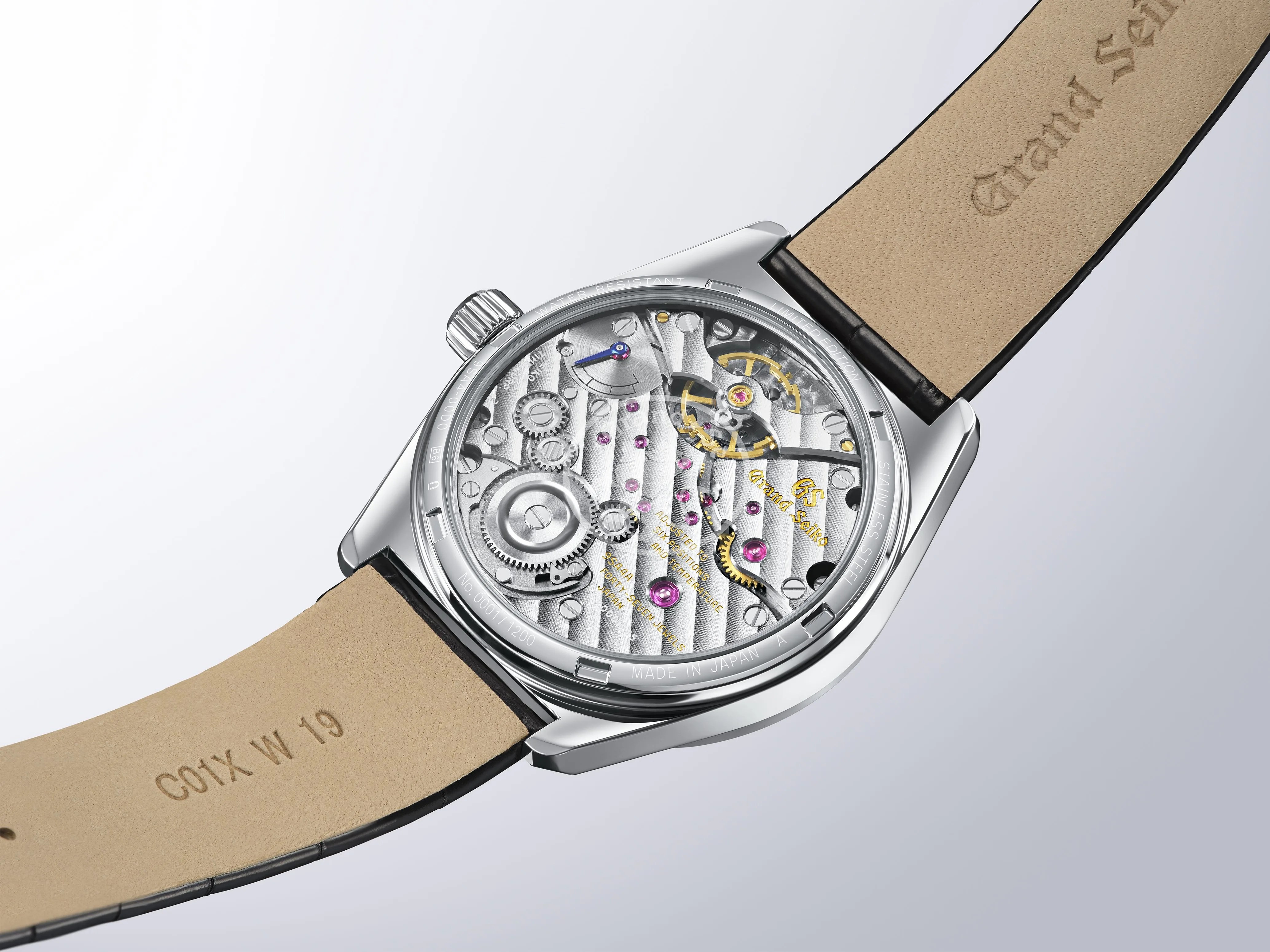 grand seiko mechanical watch movement seen through a display caseback
